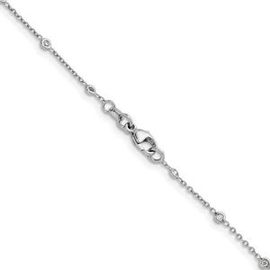 May include: A delicate silver necklace with small, round, clear gemstones evenly spaced along the chain. The necklace features a lobster clasp closure and is designed for a minimalist aesthetic. The chain is thin and appears to be made of a shiny metal.