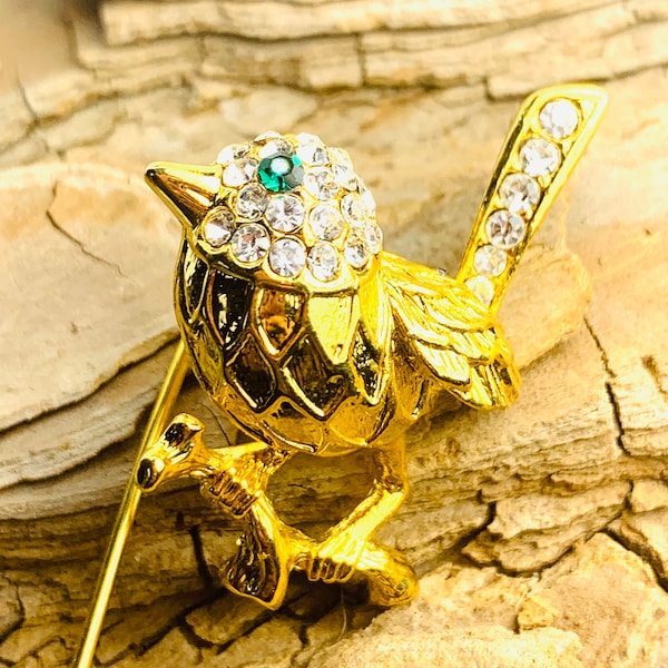 Bird stick pin with Swarovski crystals and green gem eye