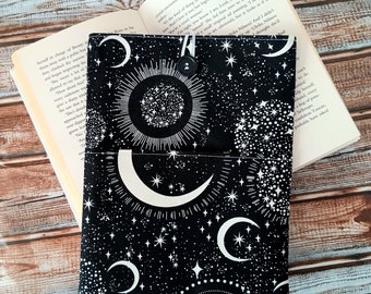 Book Sleeve with optional front pocket, great book lovers gift. Moon and stars pattern. Bookmark add on option. Padded book cover.