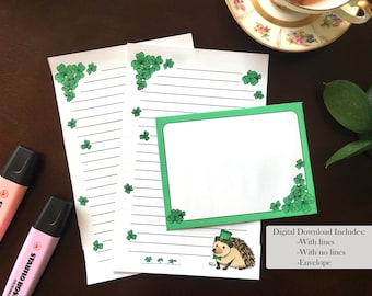 May include: Printable stationery set with a green shamrock border and a hedgehog wearing a green hat. The set includes two sheets of lined paper and one envelope.