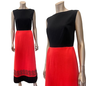 May include: A black and red sleeveless dress with a black velvet trim and a geometric pattern around the hem.