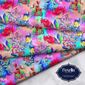 May include: A seamless digital pattern featuring a colourful, whimsical design of Ariel from The Little Mermaid decorating a Christmas tree with sea creatures. The background is a vibrant pink and blue ombre with white snowflakes.