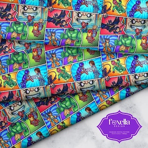 May include: A fabric print featuring a repeating comic book panel design with various superhero minifigures including Hulk, Iron Man, and Batman. The colorful pattern includes action scenes, speech bubbles, and a purple logo label with the text Foxella Design.