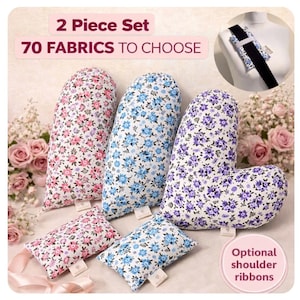 Könnte beinhalten: Ein Set aus Schulterkissen und Sicherheitsgurtbezügen mit Blumenmuster in Rosa, Blau und Lila. Das Bild enthält den Text "2 Piece Set" und "70 Fabrics to Choose". Optionale Schulterbänder sind ebenfalls abgebildet.