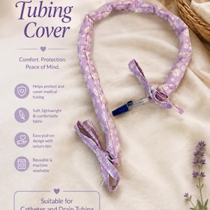 May include: A lavender fabric tubing cover featuring a white daisy pattern with secure ties at both ends. The text on the image reads: Tubing Cover, Comfort. Protection. Peace of Mind. Helps protect and cover medical tubing, Soft, lightweight & comfortable fabric, Easy pull-on design with secure ties, Reusable & machine washable, Suitable for Catheter and Drain Tubing.