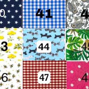 May include: A grid of nine fabric swatches labeled 40 through 48. Patterns include navy stars, blue gingham, paisley, lemons, black dogs on light blue, tropical leaves, bees, red gingham, and pink fabric with white polka dots.