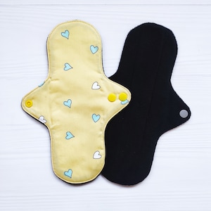 Cotton reusable cloth pads with hearts. Zero waste organic panty liners. Washable sanitary napkins