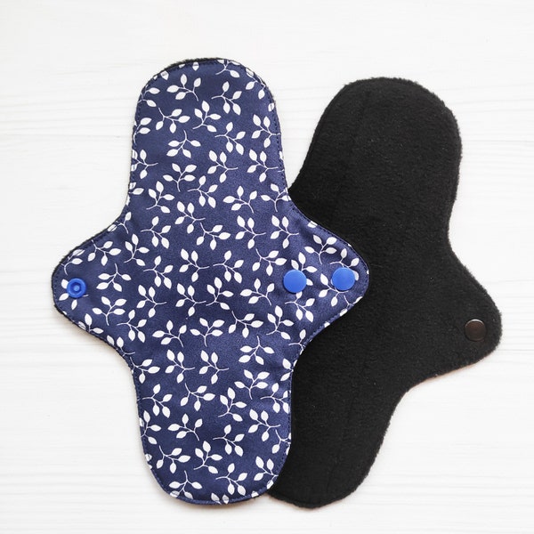 Reusable sanitary napkins with small leaves. Blue cotton cloth pads. Fabric panty liners with wings. Washable panty shield.