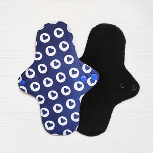 Reusable cloth pads with hearts. Fabric menstrual pads. Cotton sanitary napkins. Zero waste washable panty liners.