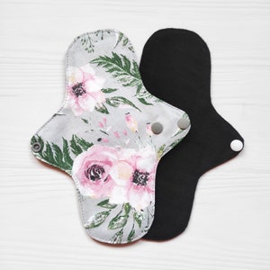 Menstrual cloth pads with flowers. Cotton reusable pads with wings. Eco friendly fabric sanitary napkins.
