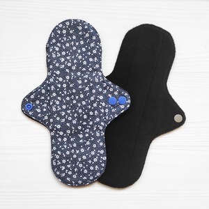 Menstrual panty liners. Reusable cotton cloth pads with small flowers. Organic flannel or fleece with bamboo to the skin. Zero waste pads.