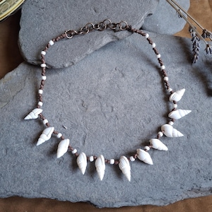 Whelk shell choker necklace with small white shells. Dainty surf jewelry for women, tribal sea jewelry, handmade womens shell necklace