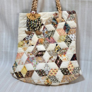 A strangely shaped bag with a clown mascot on it, made from Liberty Tana Lawn