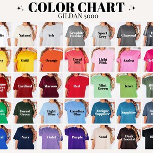 May include: A color chart displaying a variety of Gildan 5000 t-shirts in various colors. The chart includes colors such as white, natural, ash, graphite heather, sport grey, charcoal, dark heather, daisy, gold, orange, coral silk, light pink, and azalea.