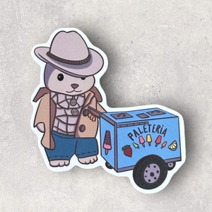 May include: A cartoon illustration of a rabbit wearing a brown coat, a white and blue plaid shirt, blue jeans, and a brown fedora hat, pushing a blue ice cream cart with the word "Paleteria" on the side. The cart has a variety of colorful popsicles and fruit on it.