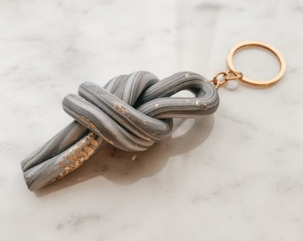 Grey shimmer marbled with gold leaf knot keyring