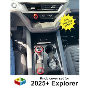 May include: Interior view of a car's console featuring a red and black knob cover set. The console has a black finish with red stitching. The image includes the text "Knob cover set for 2025+ Explorer" and a "Free Shipping in USA" graphic.
