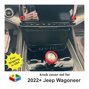 May include: A set of red knob covers for a 2022+ Jeep Wagoneer. The covers are shown installed on the vehicle's dashboard, with a silver center and red outer ring. The image also includes the text "Free Shipping in USA".
