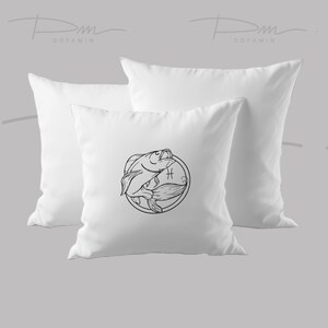 May include: Two white pillowcases with a black line drawing of the Pisces zodiac symbol on one pillowcase. The symbol is a circle with two fish swimming inside.