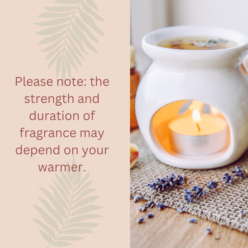 May include: A white ceramic essential oil warmer with a lit candle inside, surrounded by dried lavender and essential oil bottles. The text reads: "Please note: the strength and duration of fragrance may depend on your warmer."