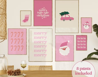 May include: A set of eight framed prints with a festive Christmas theme. The prints feature pink and white designs, including candy canes, a snowman, Santa Claus, and the text "Have a holly jolly Christmas."