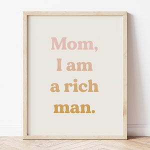 May include: A framed print with the text "Mom, I am a rich man." in a pink, orange, and yellow color scheme.