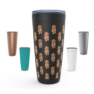 May include: A black travel tumbler featuring a repeating pattern of brown poodle illustrations. The tumbler has a black lid and is surrounded by other tumblers in teal, copper, white, and gray. The tumblers are designed to keep drinks hot or cold.