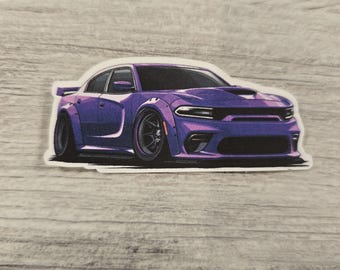 May include: A purple Dodge Charger with black wheels and a wide body kit. The car has a white sticker on it.