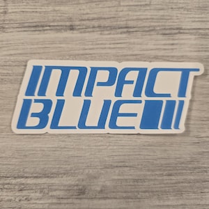 May include: A blue and white sticker with the text "IMPACT BLUE" in a bold, stylized font.