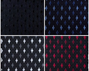 May include: A collage of four fabric swatches with repeating patterns. The top left swatch is solid navy blue. The top right features blue diamond shapes on a navy background. The bottom left has white and gray diamonds. The bottom right has red diamonds.