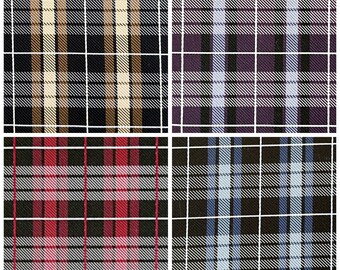 May include: Four fabric swatches with plaid patterns. The top left swatch is black with tan and white stripes. The top right swatch is purple with light blue and white stripes. The bottom left swatch is black with red and white stripes. The bottom right swatch is black with blue and white stripes.