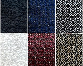 May include: Six fabric swatches with a geometric diamond pattern. The swatches are in black, blue, silver, white, red, and gold.