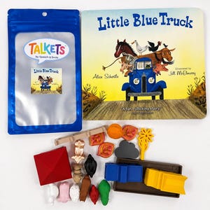 May include: A Little Blue Truck board book by Alice Schertle, a blue Talkets storage pouch, and a collection of small plastic animal and vehicle figurines including a red barn, a blue truck, a yellow trailer, and various farm animals.