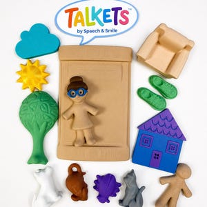 May include: A set of Talkets by Speech & Smile toys including a tan bed, a tan figure with blue glasses, a tan armchair, a blue house with a purple roof, a green tree, a yellow sun, a teal cloud, green shoes, and various small animal and figure shapes.