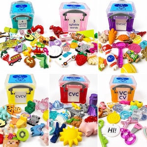 May include: Six colorful plastic storage bins with labels like 4 syllable words, 3 syllable words, CVCVC, CVCV, CVC, and VCCV, each surrounded by a variety of small, multi-colored plastic miniature figurines, charms, and shapes for speech therapy.