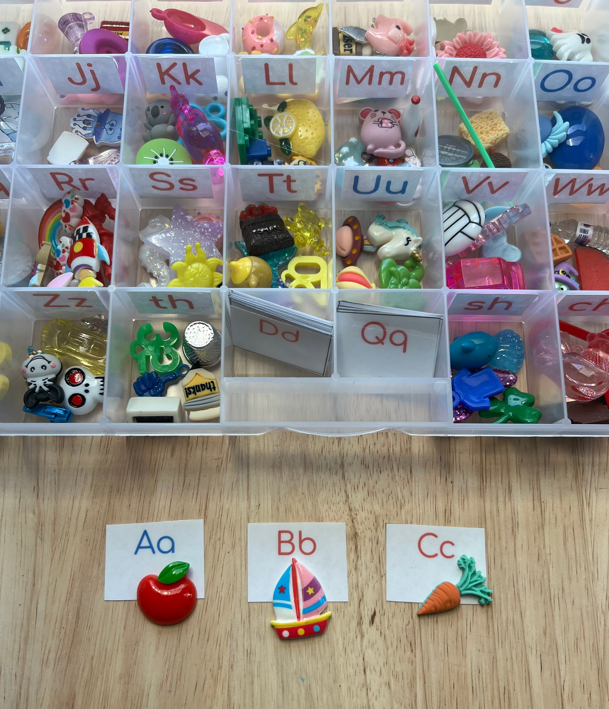 Alphabet Trinkets In Storage All Sounds With Alphabet Book Montessori