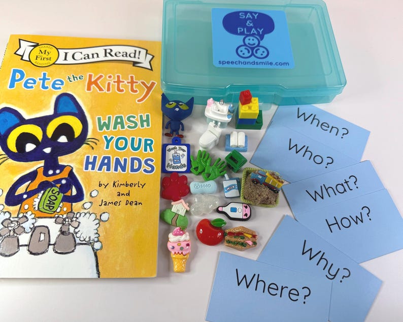May include: A children's educational set featuring a book titled "Pete the Kitty Wash Your Hands" and a blue plastic storage box. The set includes small toy figures, cards with questions, and various miniature food and object toys.