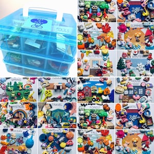 May include: A translucent blue plastic storage case with three tiers and a white handle, containing numerous small, colorful miniature figurines categorized by themes such as animals, seasons, kitchen, farm, house, travel, and space.