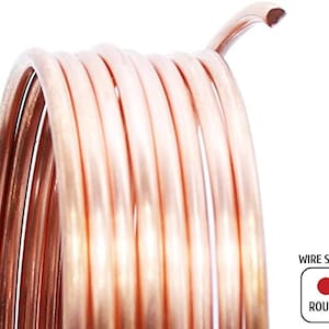 May include: Close-up of a coil of copper wire with a round shape. The wire is a warm, reddish-brown color and is tightly wound. The end of the wire is curved. The image includes a graphic that says "WIRE SHAPE" and "ROUND".