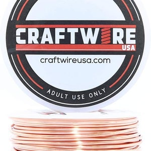May include: A spool of rose gold colored wire, labeled "CRAFTWIRE USA" with the website "craftwireusa.com". The label also says "Made in USA" and "Adult Use Only".