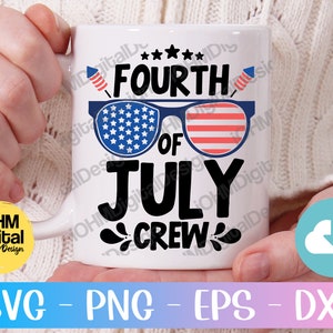 May include: White ceramic mug with a Fourth of July design. The design features a pair of sunglasses with red, white and blue stars and stripes. The text "FOURTH OF JULY CREW" is printed in black.