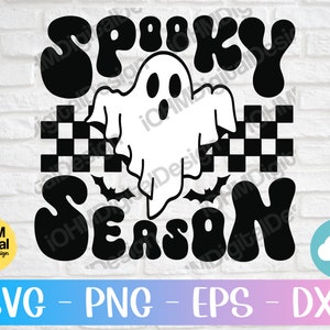 May include: Black and white graphic design with the text "Spooky Season" in a retro font. A ghost with a friendly face is in the center of the design.
