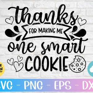May include: Black and white graphic design with the text "thanks for making me one smart cookie". The design includes a cookie with a bite taken out of it and hearts.