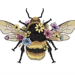 May include: A black and yellow bumblebee with colourful flowers on its back and wings. The bee is in flight with its wings spread out.