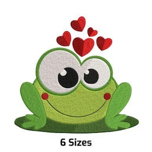 May include: A green frog with big eyes and a smile is surrounded by red hearts. The frog is sitting on a green lily pad.