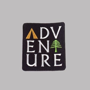 May include: Black embroidered patch with white text that reads "ADVENTURE". A gold tent icon is above the "A" and a green pine tree icon is to the right of the "N".