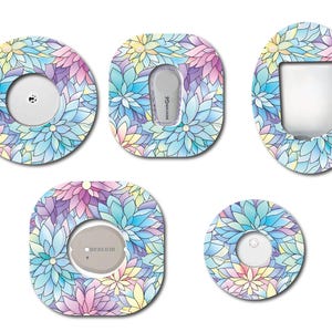 May include: Five different designs of colorful floral patterned medical device covers. The designs feature a variety of blue, pink, yellow, and purple flowers. The covers are designed to fit over a medical device, such as a continuous glucose monitor.