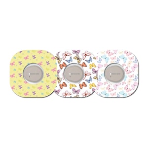 May include: Three square stickers with a butterfly pattern. The stickers are yellow, white, and pink with a grey circle in the centre that says "Dexcom".