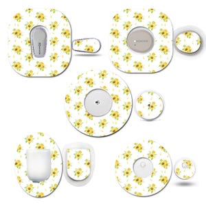 May include: A selection of adhesive patches for medical devices, decorated with a repeating pattern of yellow sunflowers on a white backdrop. The patches come in various shapes and sizes, suitable for different devices.