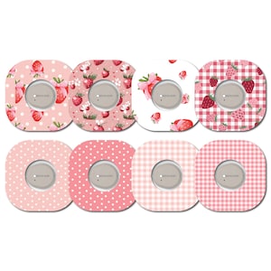 May include: Eight adhesive patches with a central circular opening, featuring various patterns. Designs include strawberries, polka dots, and gingham in shades of pink and red. Each patch has a gray circular centre with the text "dexcom".